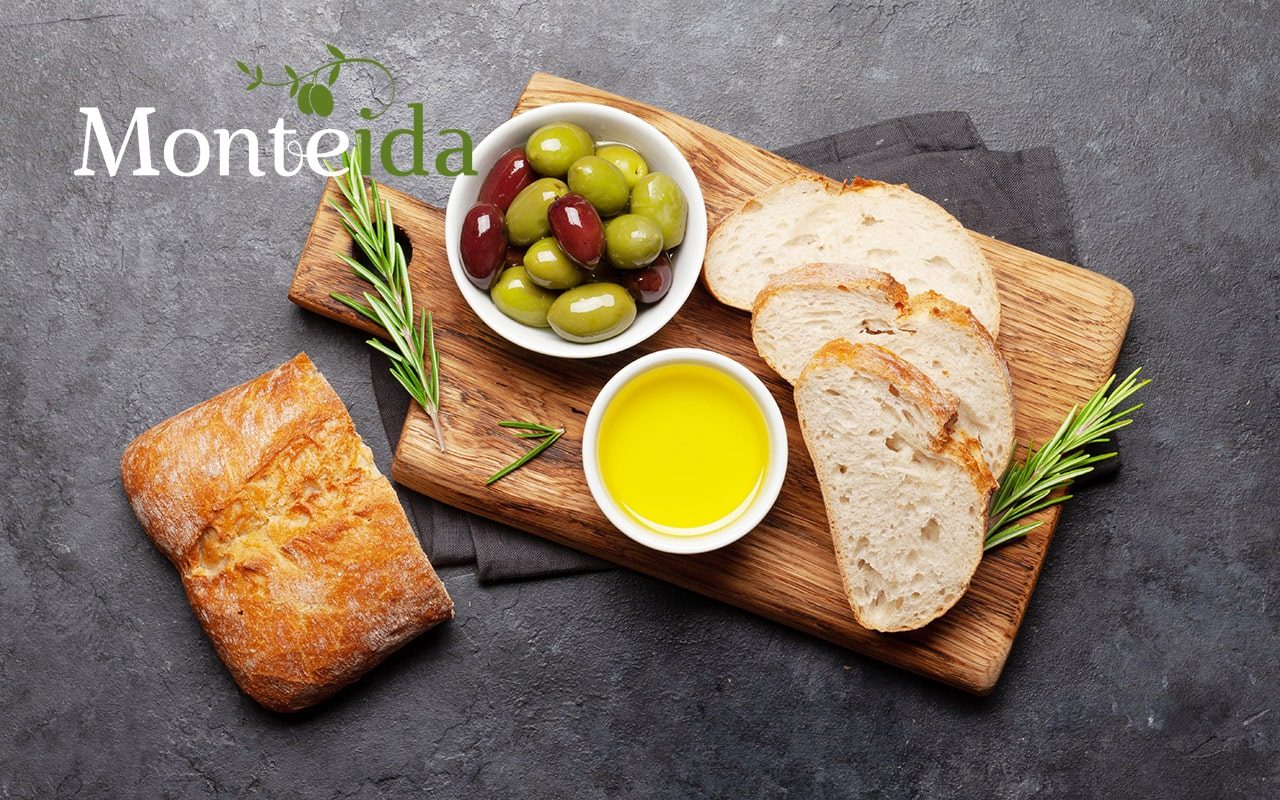 ripe olives olive oil and ciabatta 2022 min